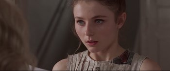 Movie still from “Last Night in Soho” (2021), directed by Edgar Wright – A person wearing a dress; Close Up shot, Over the shoulder angle