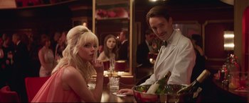 Movie still from “Last Night in Soho” (2021), directed by Edgar Wright – A man and a woman sitting at a table; Medium shot, Over the shoulder angle