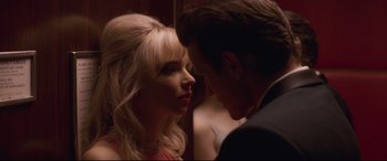 Movie still from “Last Night in Soho” (2021), directed by Edgar Wright – A man and a woman looking into each others eyes; Close Up shot, Over the shoulder angle