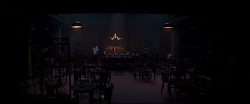 Movie still from “Last Night in Soho” (2021), directed by Edgar Wright – An image of a woman on stage in a theater setting; Extreme Wide shot, High angle