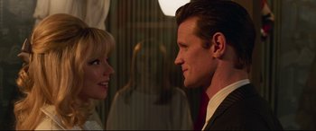 Movie still from “Last Night in Soho” (2021), directed by Edgar Wright – A man and a woman looking at one another; Close Up shot, Over the shoulder angle
