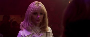 Movie still from “Last Night in Soho” (2021), directed by Edgar Wright – A woman with blonde hair wearing a white shirt; Close Up shot, Over the shoulder angle