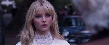 Movie still from “Last Night in Soho” (2021), directed by Edgar Wright – A person wearing a white shirt; Close Up shot, Over the shoulder angle