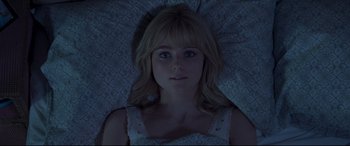 Movie still from “Last Night in Soho” (2021), directed by Edgar Wright – A woman laying in a bed looking at the camera; Close Up shot, Overhead angle