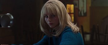 Movie still from “Last Night in Soho” (2021), directed by Edgar Wright – A woman with long blonde hair sitting in a room; Close Up shot, Over the shoulder angle