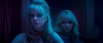 Movie still from “Last Night in Soho” (2021), directed by Edgar Wright – A woman with blonde hair standing next to another woman with blonde hair; Close Up shot, Low angle
