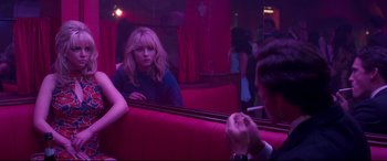 Movie still from “Last Night in Soho” (2021), directed by Edgar Wright – A woman sitting in front of a mirror in front of a man; Medium shot, Over the shoulder angle