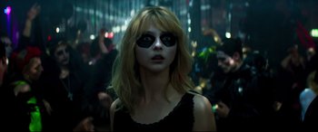 Movie still from “Last Night in Soho” (2021), directed by Edgar Wright – A woman with black makeup on her face; Close Up shot, Over the shoulder angle