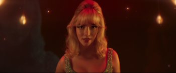Movie still from “Last Night in Soho” (2021), directed by Edgar Wright – A woman with blonde long hair and bangs; Close Up shot, Low angle