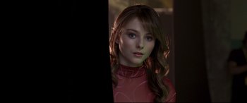 Movie still from “Last Night in Soho” (2021), directed by Edgar Wright – A woman with long brown hair wearing a red shirt; Close Up shot, Over the shoulder angle