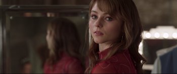 Movie still from “Last Night in Soho” (2021), directed by Edgar Wright – A person wearing a red shirt; Close Up shot, Over the shoulder angle