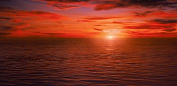 Movie still from “Midnight Mass” (2021), directed by Mike Flanagan – The sun is setting over a body of water; Extreme Wide shot, High angle