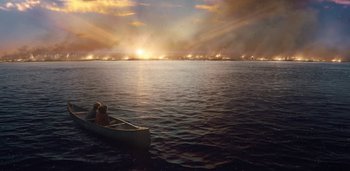 Movie still from “Midnight Mass” (2021), directed by Mike Flanagan – Two people in a canoe on a body of water; Extreme Wide shot, High angle