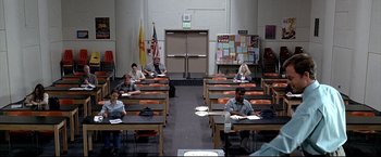 Movie still from “Little Miss Sunshine” (2006), directed by Jonathan Dayton – A group of people sitting at desks in a classroom; Wide shot, High angle
