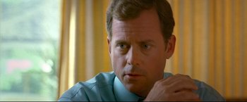 Movie still from “Little Miss Sunshine” (2006), directed by Jonathan Dayton – A person wearing a shirt and tie; Close Up shot, Over the shoulder angle