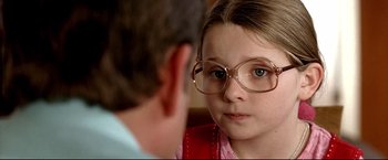 Movie still from “Little Miss Sunshine” (2006), directed by Jonathan Dayton – A young girl wearing glasses looking at an older man; Close Up shot, Over the shoulder angle