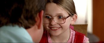 Movie still from “Little Miss Sunshine” (2006), directed by Jonathan Dayton – A young girl wearing glasses looking at an older man; Close Up shot, Over the shoulder angle