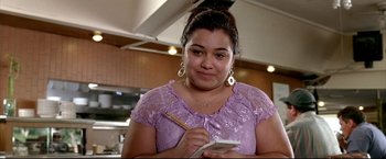 Movie still from “Little Miss Sunshine” (2006), directed by Jonathan Dayton – A woman writing on a piece of paper in a kitchen; Close Up shot, Low angle