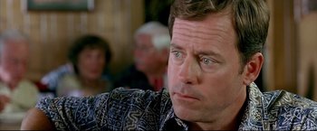 Movie still from “Little Miss Sunshine” (2006), directed by Jonathan Dayton – A person wearing a black and white shirt; Close Up shot, Over the shoulder angle