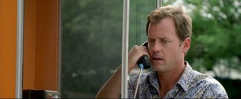 Movie still from “Little Miss Sunshine” (2006), directed by Jonathan Dayton – A person talking on a cell phone; Close Up shot, Low angle