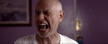 Movie still from “Little Miss Sunshine” (2006), directed by Jonathan Dayton – An older man with a bald head is yelling with his mouth wide open; Close Up shot, Low angle