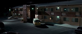 Movie still from “Little Miss Sunshine” (2006), directed by Jonathan Dayton – A van is parked in a parking lot at night; Extreme Wide shot, Low angle