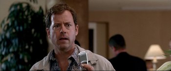 Movie still from “Little Miss Sunshine” (2006), directed by Jonathan Dayton – A person holding a cell phone; Close Up shot, Low angle