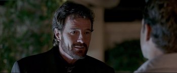 Movie still from “Little Miss Sunshine” (2006), directed by Jonathan Dayton – A person wearing a suit and tie; Close Up shot, Over the shoulder angle