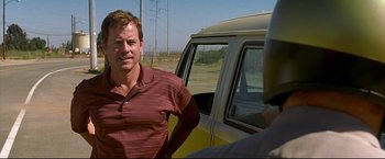 Movie still from “Little Miss Sunshine” (2006), directed by Jonathan Dayton – A man standing in front of a yellow van; Medium shot, Over the shoulder angle