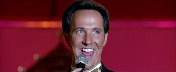 Movie still from “Little Miss Sunshine” (2006), directed by Jonathan Dayton – A person holding a microphone; Close Up shot, Low angle