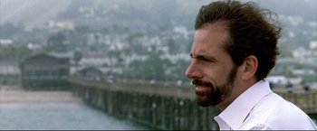 Movie still from “Little Miss Sunshine” (2006), directed by Jonathan Dayton – A person with a beard looking at a bridge; Close Up shot, Over the shoulder angle