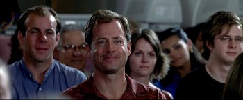 Movie still from “Little Miss Sunshine” (2006), directed by Jonathan Dayton – A group of men and women standing in front of a man; Close Up shot, Over the shoulder angle