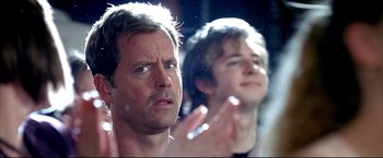 Movie still from “Little Miss Sunshine” (2006), directed by Jonathan Dayton – A man and a woman looking at the camera; Close Up shot, Over the shoulder angle