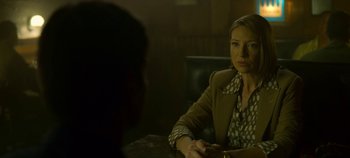 Movie still from “Mindhunter” (2017), directed by Tobias Lindholm – A woman sitting in front of a man at a table; Medium shot, Over the shoulder angle