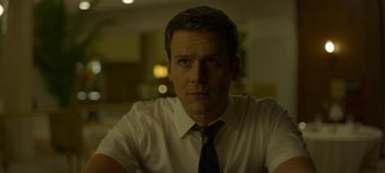 Movie still from “Mindhunter” (2017), directed by Tobias Lindholm – A person wearing a shirt and a tie; Close Up shot, Low angle