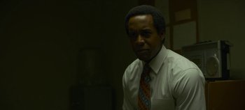 Movie still from “Mindhunter” (2017), directed by Tobias Lindholm – A man in a white dress shirt and a tie; Close Up shot, Low angle