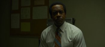 Movie still from “Mindhunter” (2017), directed by Tobias Lindholm – A man in a white dress shirt and a tie; Close Up shot, Low angle