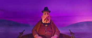 Movie still from “Missing Link” (2019), directed by Chris Butler – A man with a mustache and a hat is sitting in front of a purple sky; Medium shot, Low angle