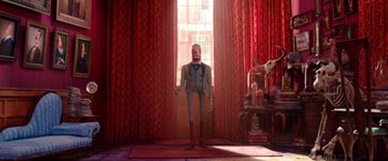 Movie still from “Missing Link” (2019), directed by Chris Butler – A man standing in front of a window with red drapes; Wide shot, Low angle