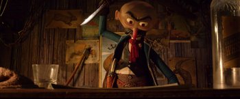 Movie still from “Missing Link” (2019), directed by Chris Butler – A man holding a knife in his hand and wearing a cowboy outfit; Medium shot, Low angle