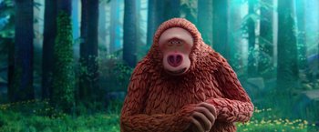 Movie still from “Missing Link” (2019), directed by Chris Butler – A monkey that is standing in front of a forest; Close Up shot, Low angle