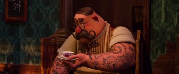 Movie still from “Missing Link” (2019), directed by Chris Butler – A man with a mustache and a beard is holding a cup; Medium shot, Over the shoulder angle