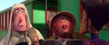 Movie still from “Missing Link” (2019), directed by Chris Butler – A person sitting down with an open book in their hands; Close Up shot, Low angle