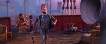 Movie still from “Missing Link” (2019), directed by Chris Butler – A man in a suit and tie standing next to a pole; Wide shot, Over the shoulder angle