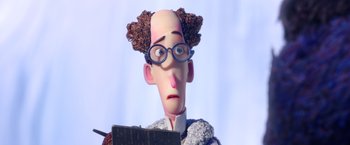 Movie still from “Missing Link” (2019), directed by Chris Butler – A cartoon of a man with glasses and curly hair looking surprised; Close Up shot, Low angle