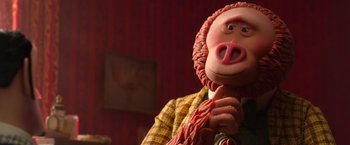 Movie still from “Missing Link” (2019), directed by Chris Butler – A person wearing a pig mask; Close Up shot, Over the shoulder angle