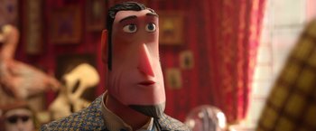 Movie still from “Missing Link” (2019), directed by Chris Butler – The face of a man in a suit; Close Up shot, Low angle