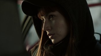 Movie still from “Money Heist” (2017), created by Álex Pina – A person wearing a hat; Close Up shot, Low angle