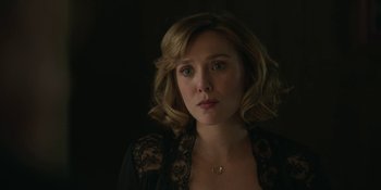 Movie still from “Love & Death” (2023), directed by Clark Johnson – A person with short hair; Close Up shot, Over the shoulder angle