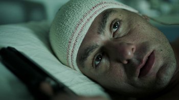 Movie still from “Money Heist” (2017), created by Álex Pina – A person wearing a hat; Close Up shot, Overhead angle